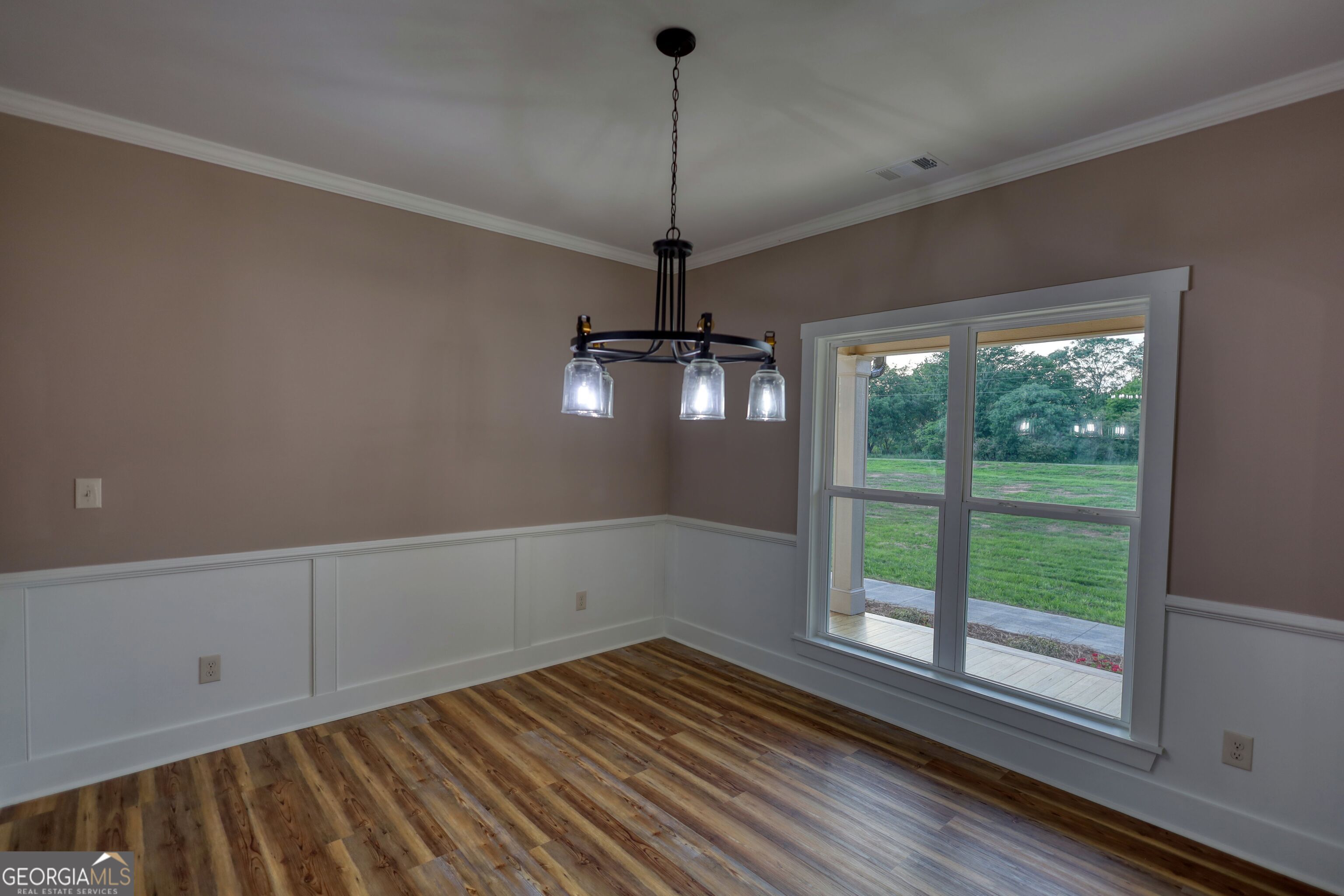 2941 Old Buckhead Road Madison, GA 30650 - Photo 5 of 58 a view of a room with wooden floor and windows