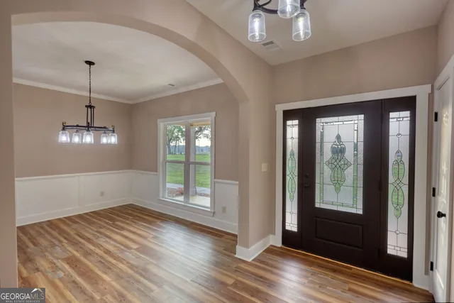 a view of livingroom with hardwood floor and hallway