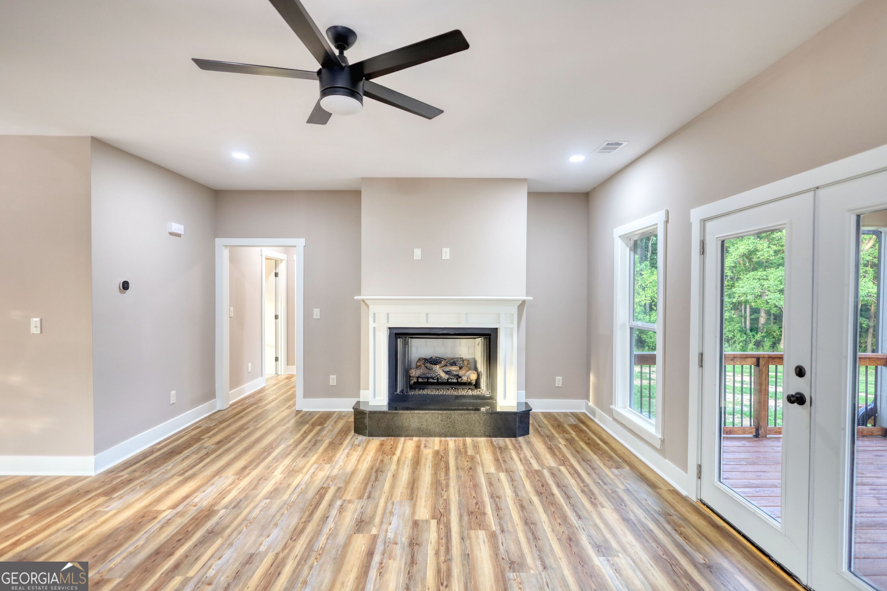 2941 Old Buckhead Road Madison, GA 30650 - Photo 9 of 58 a view of a livingroom with a fireplace wooden floor and window