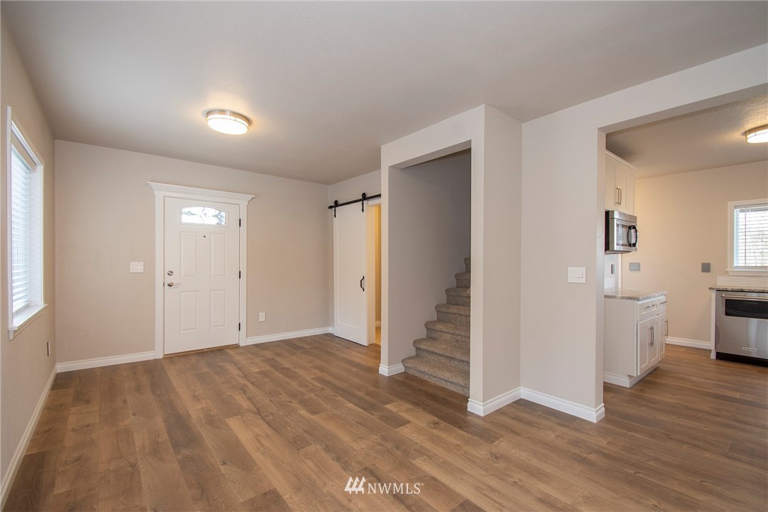 15941 Littlerock Road Southwest Rochester, WA 98579 - Photo 13 of 31 wooden floor in an empty room with a window