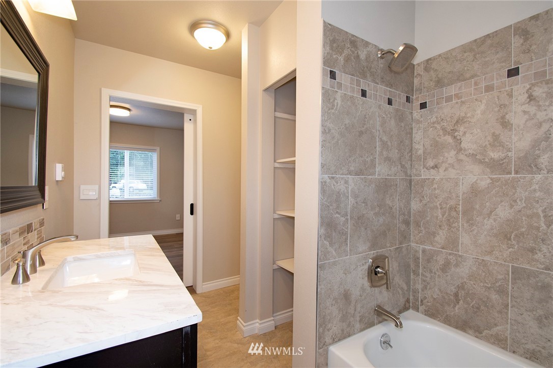 15941 Littlerock Road Southwest Rochester, WA 98579 - Photo 20 of 31 a bathroom with a sink a toilet and shower