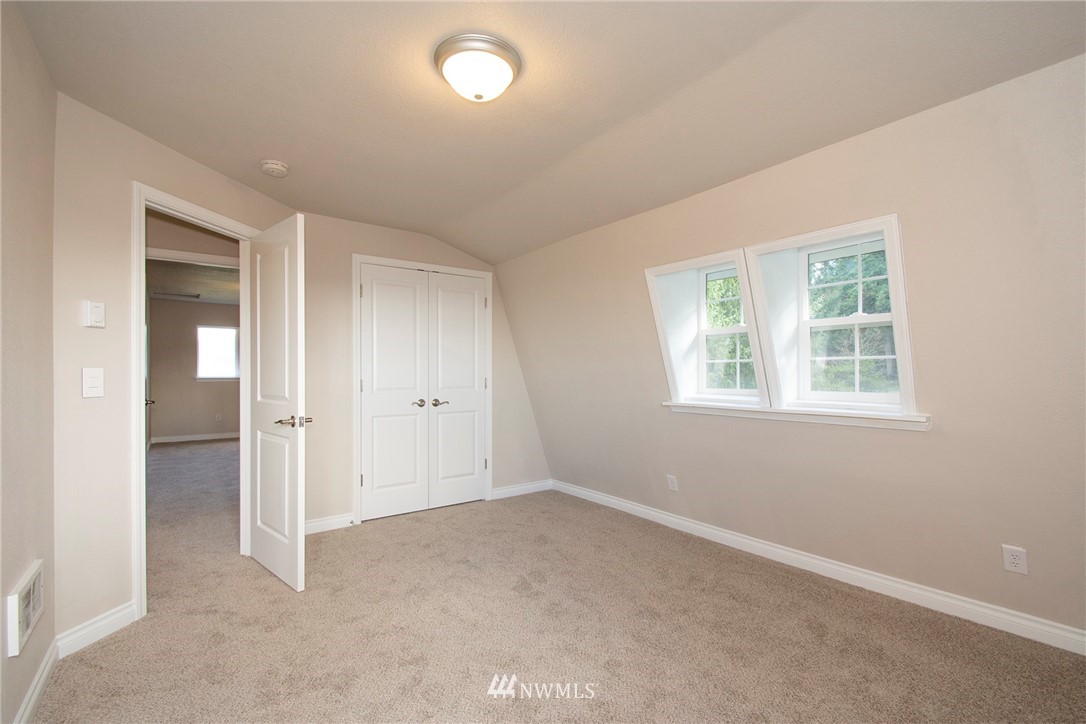 15941 Littlerock Road Southwest Rochester, WA 98579 - Photo 23 of 31 an empty room with windows and closet