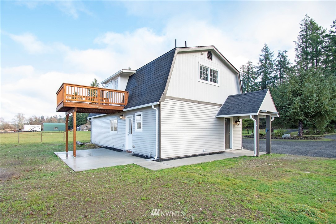 15941 Littlerock Road Southwest Rochester, WA 98579 - Photo 4 of 31 a front view of a house with a yard and garage