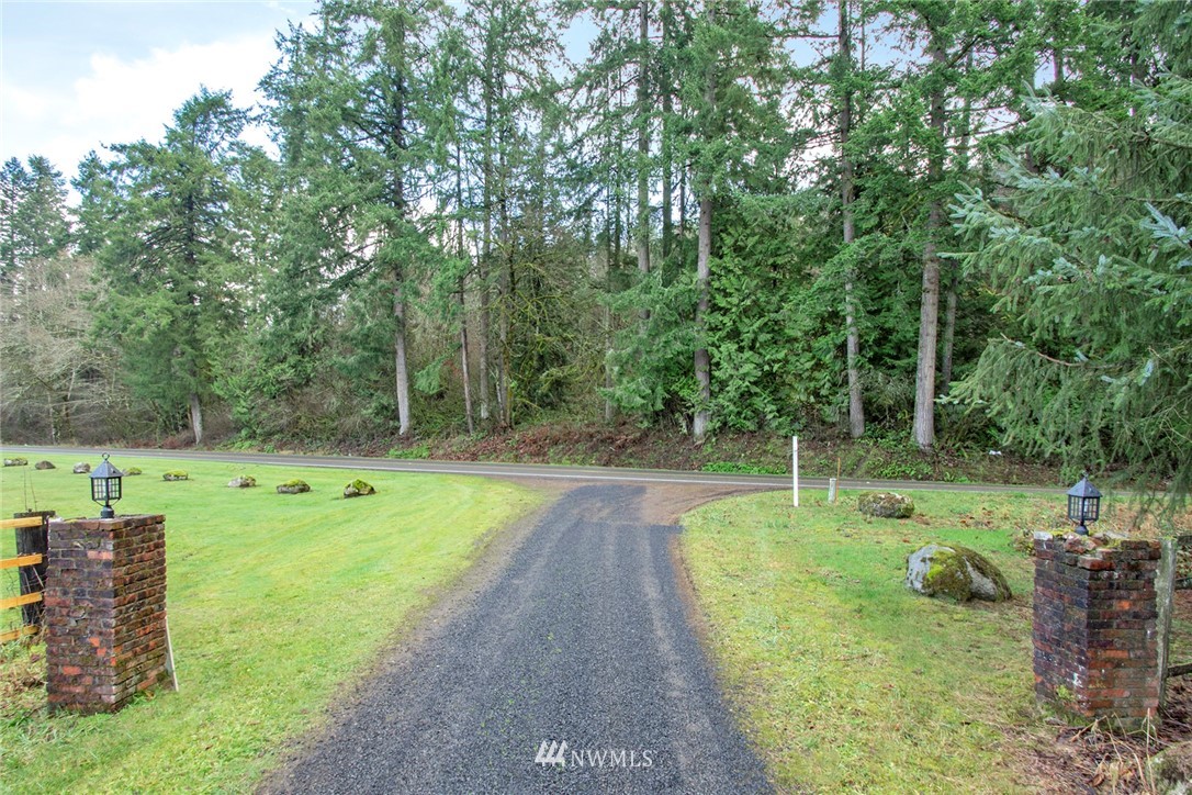 15941 Littlerock Road Southwest Rochester, WA 98579 - Photo 6 of 31 a view of a swimming pool with a yard
