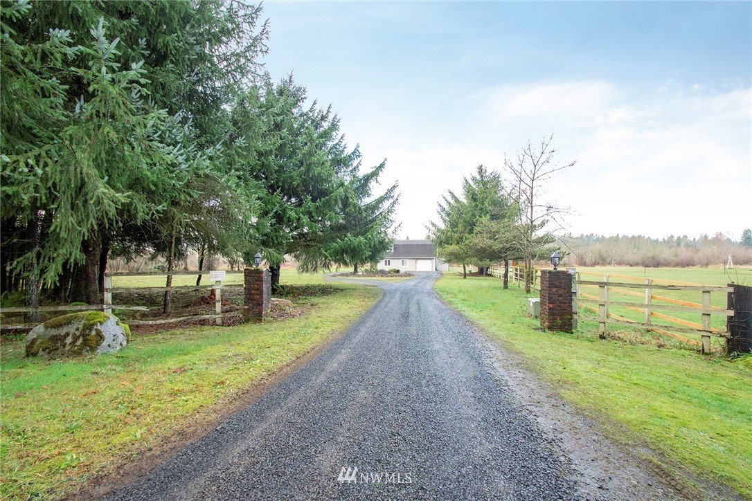 15941 Littlerock Road Southwest Rochester, WA 98579 - Photo 7 of 31 a park with large trees and a wooden fence