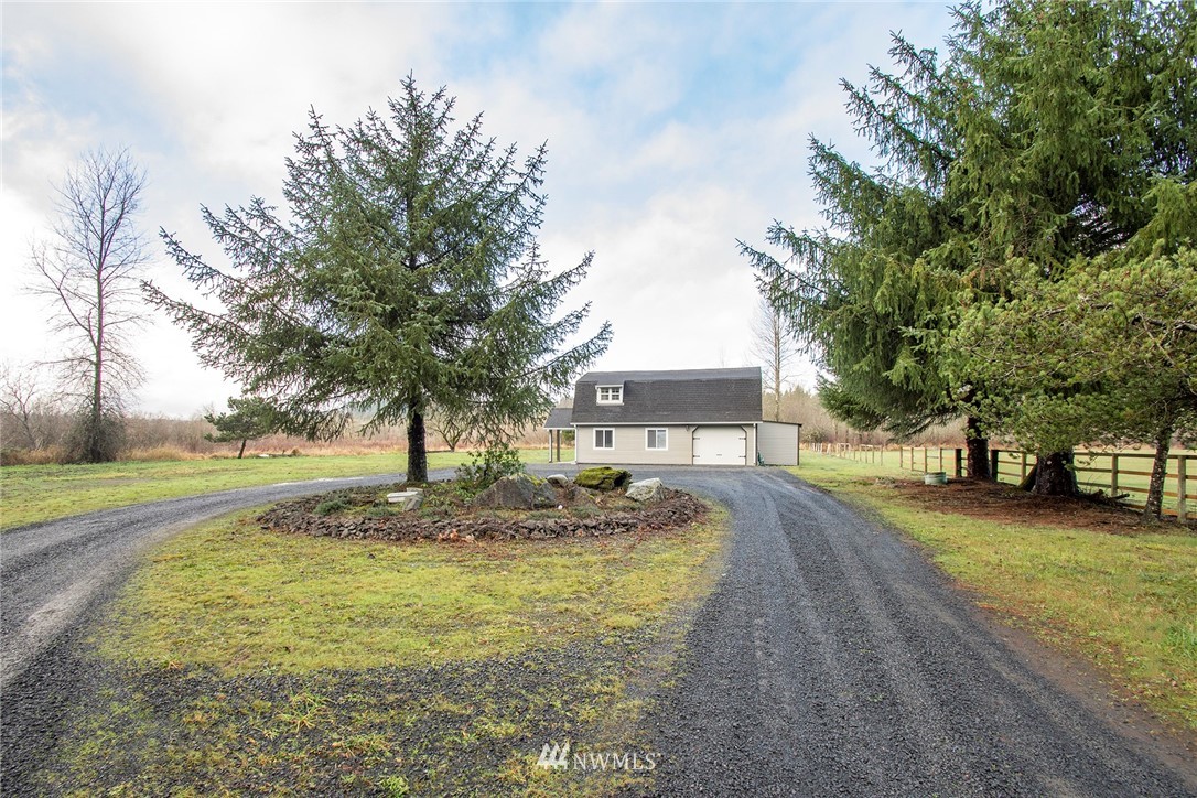 15941 Littlerock Road Southwest Rochester, WA 98579 - Photo 8 of 31 a front view of a house with a yard and trees