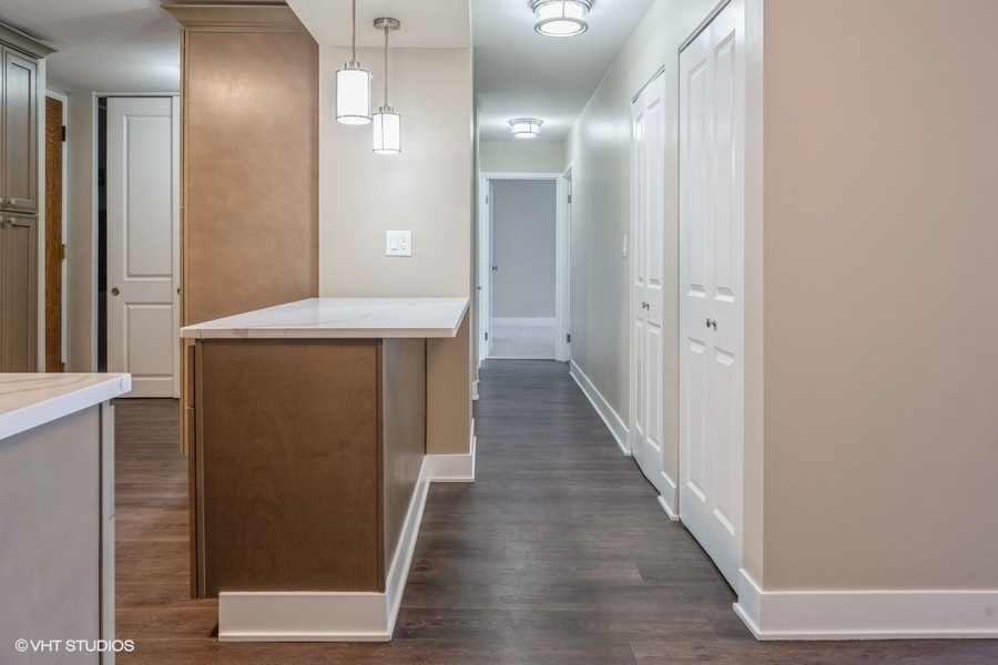 6033 North Sheridan Road, Unit 5D Chicago, IL 60660 - Photo 6 of 11 a view of a hallway with wooden floor