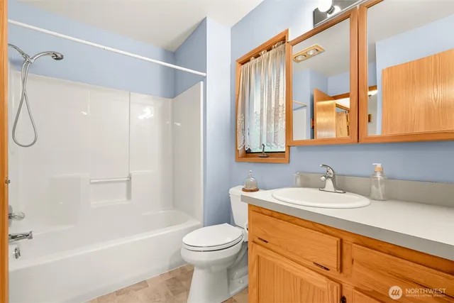 a bathroom with a sink a toilet and a bathtub