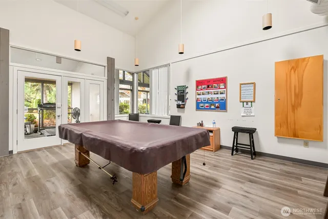 a view of a room with furniture window and wooden floor