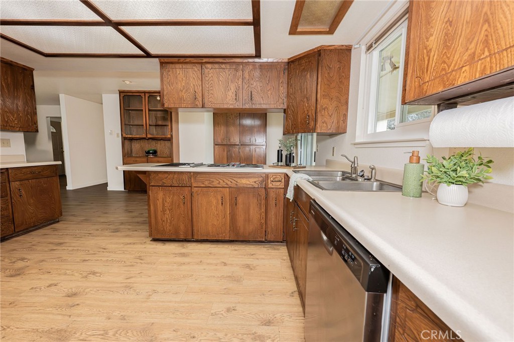 329 Byron Way Orland, CA 95963 - Photo 11 of 35 a kitchen with stainless steel appliances granite countertop a sink a stove and a refrigerator