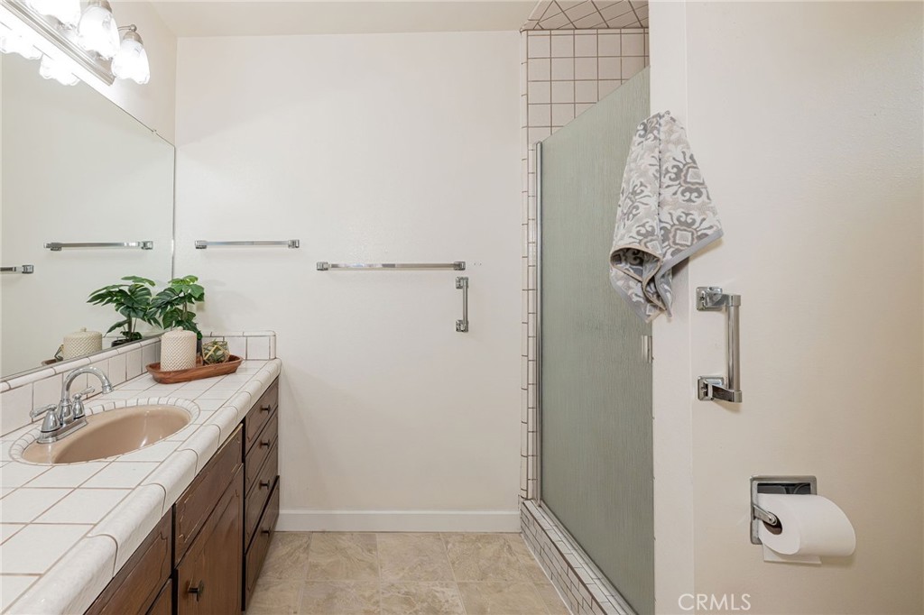 329 Byron Way Orland, CA 95963 - Photo 24 of 35 a bathroom with a sink vanity granite and shower