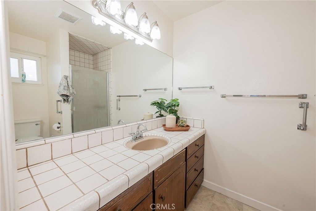 329 Byron Way Orland, CA 95963 - Photo 25 of 35 a bathroom with a sink vanity and a mirror