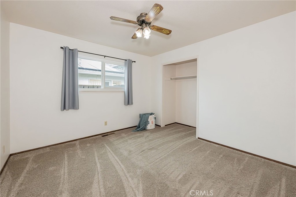 329 Byron Way Orland, CA 95963 - Photo 27 of 35 an empty room with windows and fan