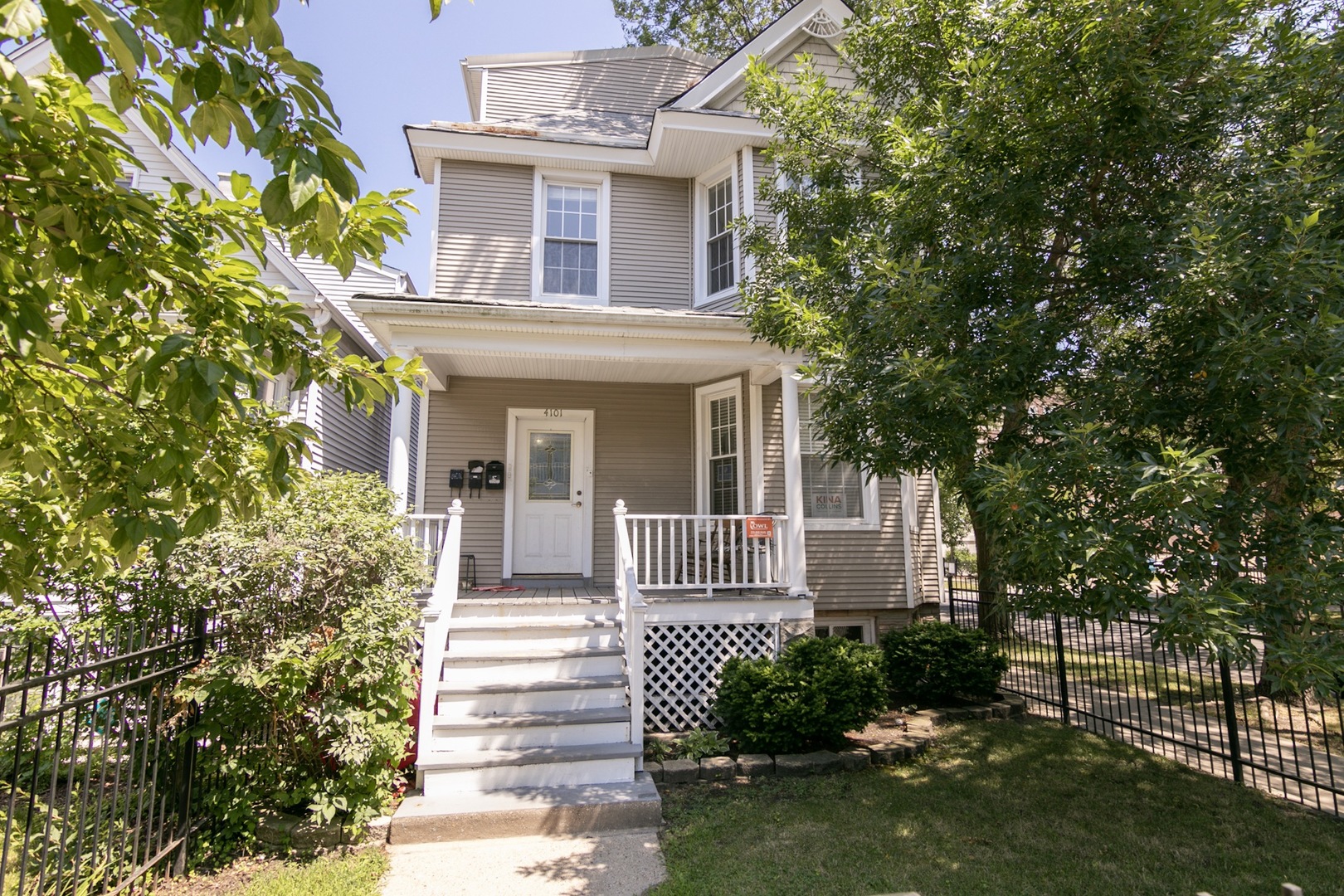 4101 North Bell Avenue, Unit 2 Chicago, IL 60618 - Photo 1 of 16 front view of a house with a yard
