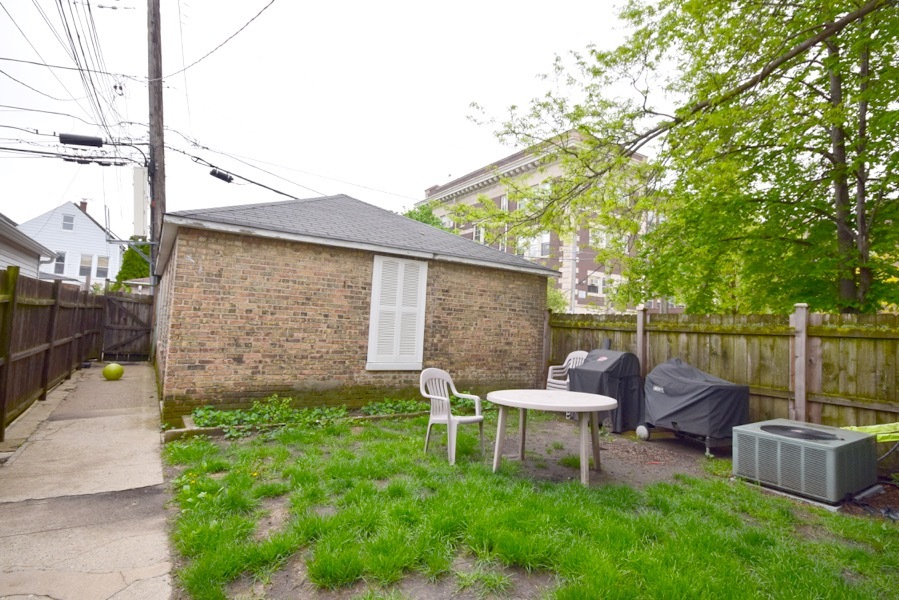 4101 North Bell Avenue, Unit 2 Chicago, IL 60618 - Photo 13 of 16 a backyard of a house with outdoor seating
