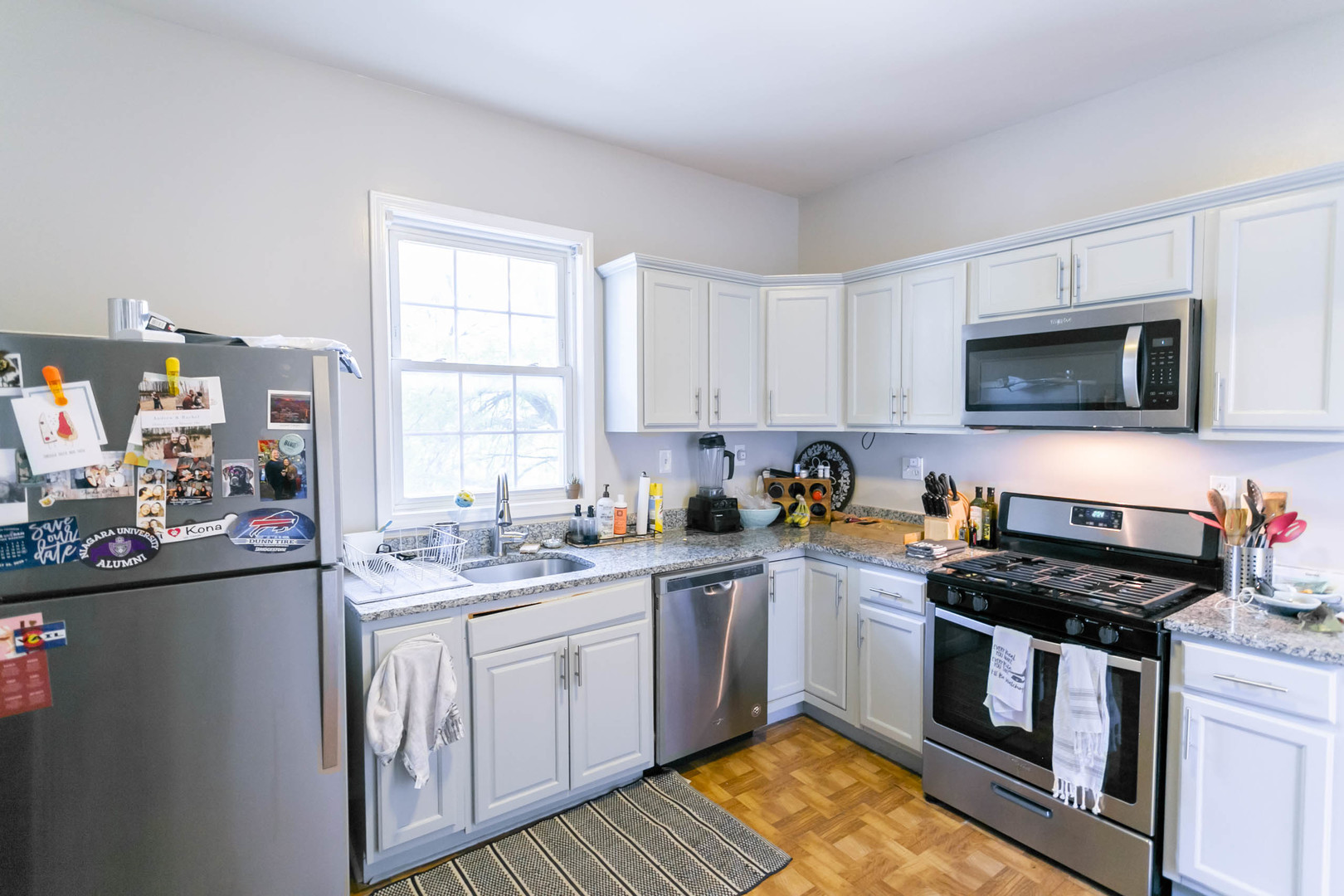 4101 North Bell Avenue, Unit 2 Chicago, IL 60618 - Photo 4 of 16 a kitchen with a sink stove top oven and microwave