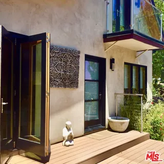 a house view with a outdoor space