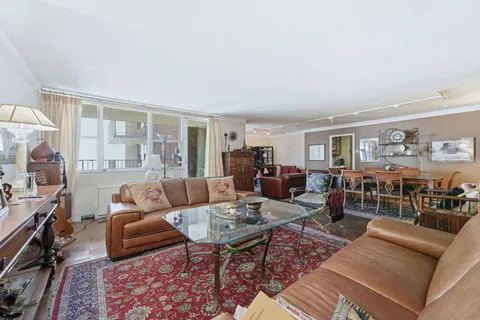 a living room with furniture and a table