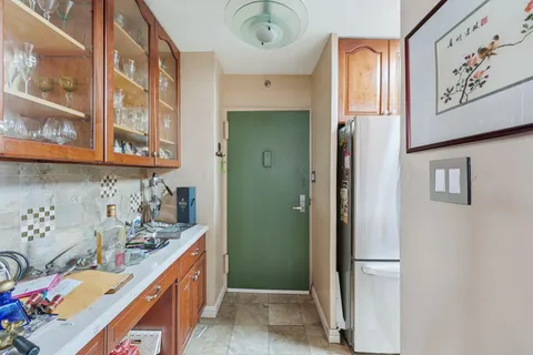 a bathroom with a sink a mirror and a shower