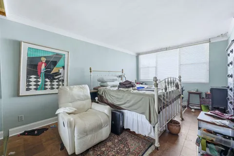 a bed room with bed and a couch