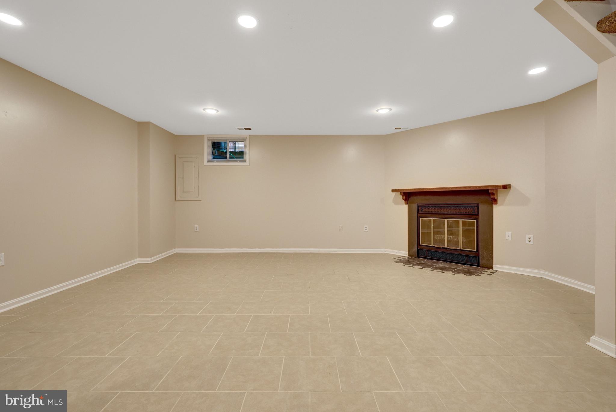 11992 Sentinel Point Court Reston, VA 20191 - Photo 36 of 49 Complete with cozy wood burning fireplace