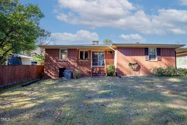 a view of a house with a yard and garage