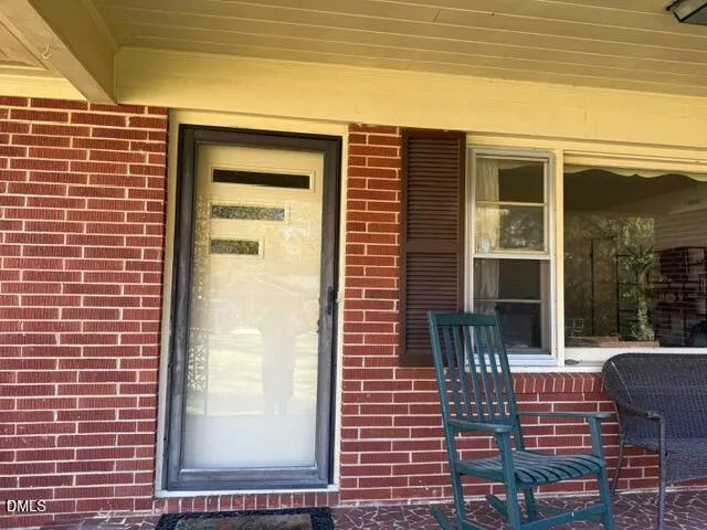 a front view of a house with a porch