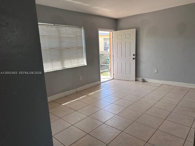 a view of an empty room and window