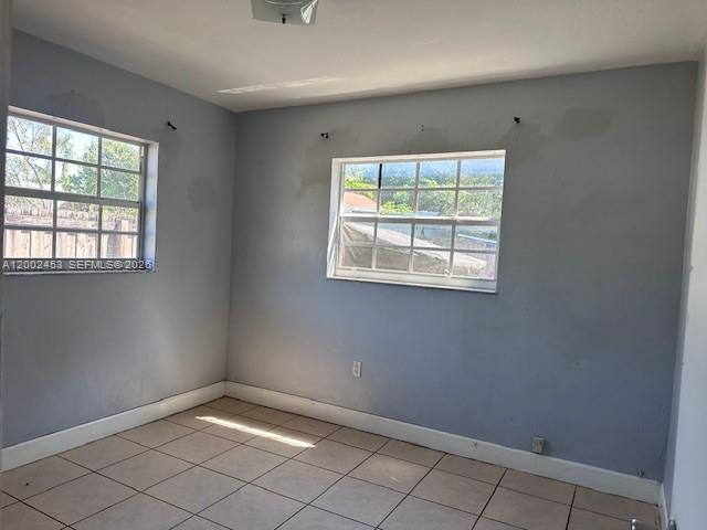 3723 Northwest 23rd Avenue, Unit 2 Miami, FL 33142 - Photo 4 of 8 an empty room with windows