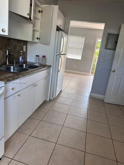 3723 Northwest 23rd Avenue, Unit 2 Miami, FL 33142 - Photo 6 of 8 a kitchen with stainless steel appliances a sink and cabinets