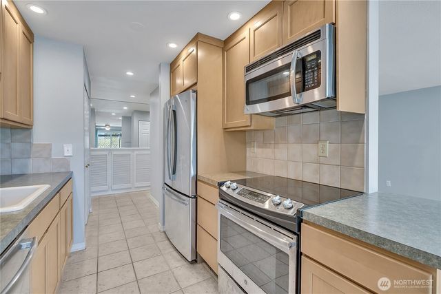 a kitchen with a stove microwave and refrigerator