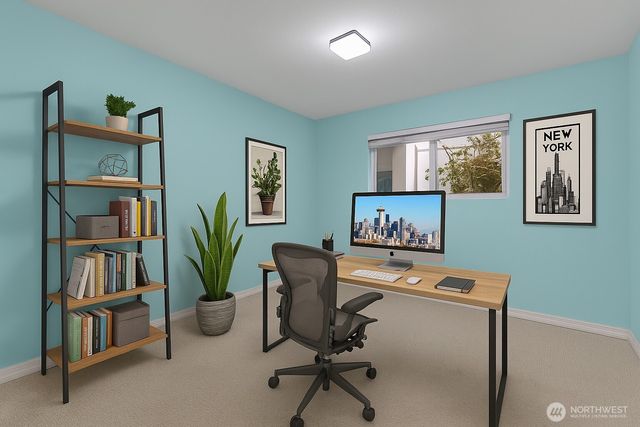 a view of a workspace with furniture and a potted plant