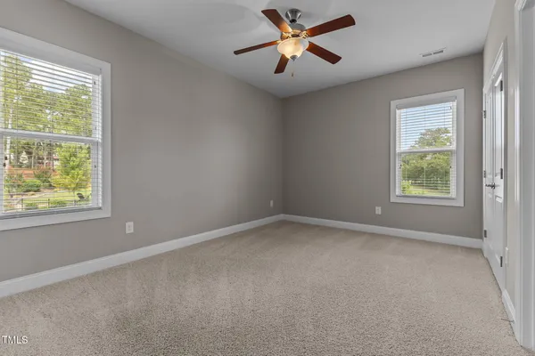 a white toilet and tub sitting next to a bathroom sink