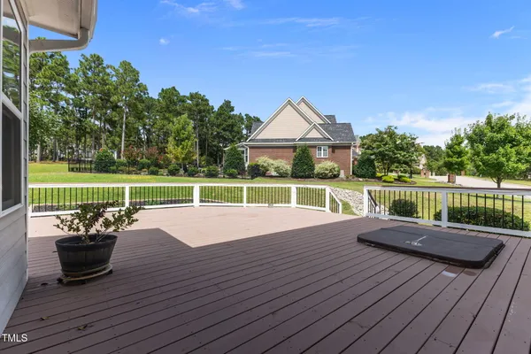 a front view of a house with a yard table and chairs