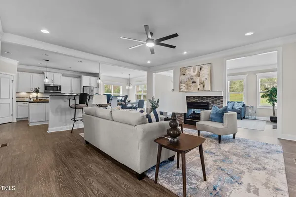 a living room with fireplace furniture and a fireplace