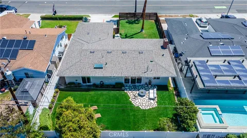 an aerial view of a house with a garden and plants