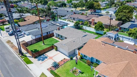 an aerial view of a house with a garden