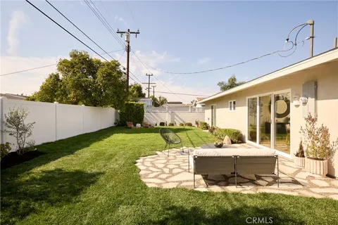 a view of a house with a yard porch and sitting area
