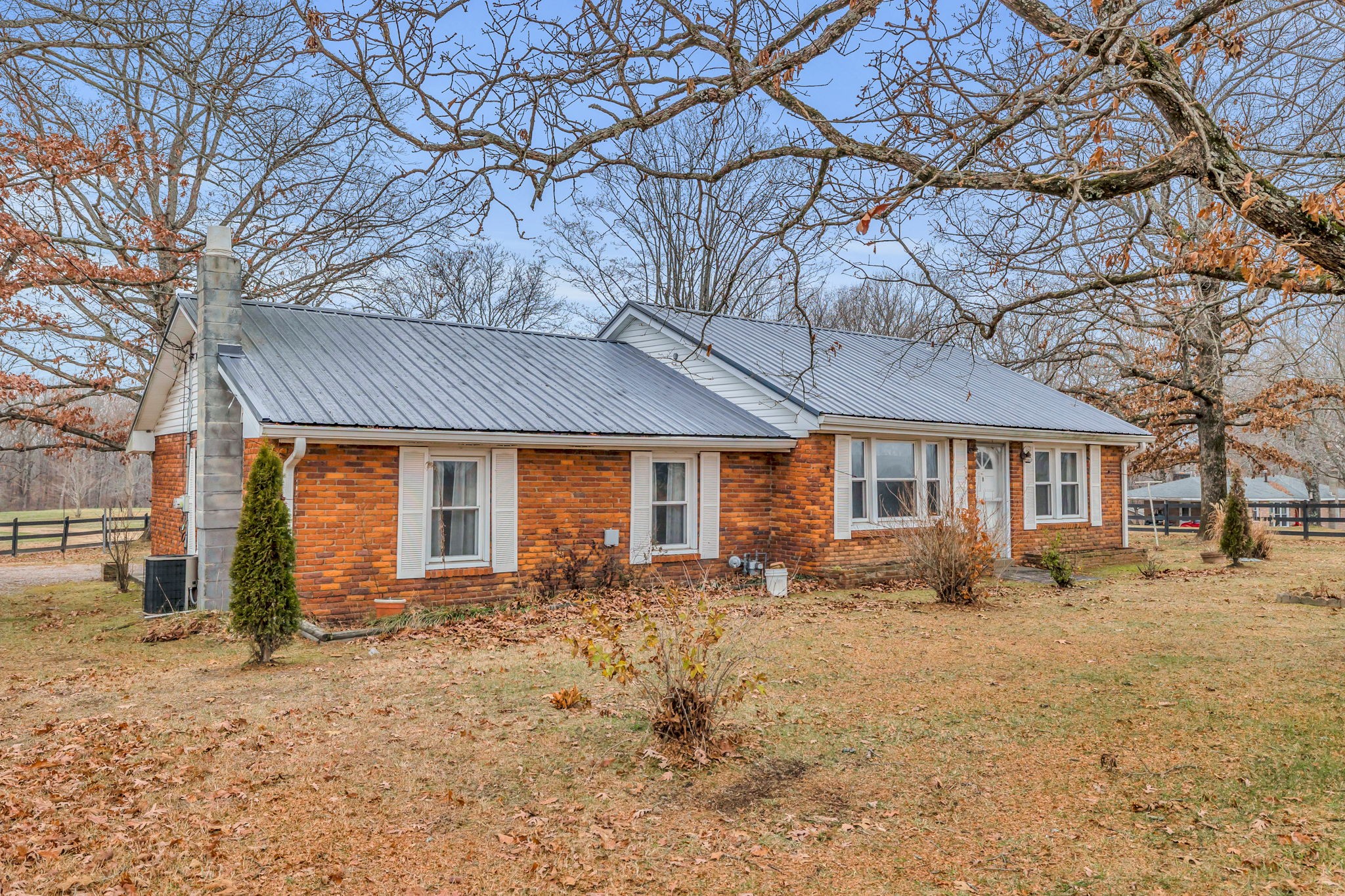7203 Old Franklin Road Fairview, TN 37062 - Photo 1 of 43 a front view of house with yard covered in snow