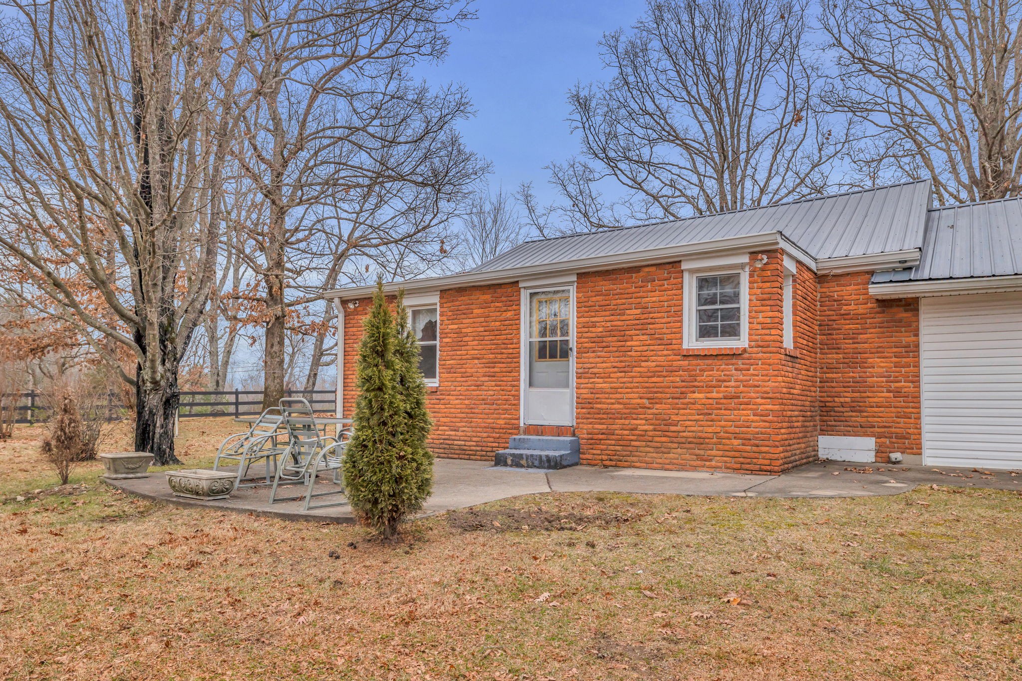 7203 Old Franklin Road Fairview, TN 37062 - Photo 36 of 43 front view of a house with a trees