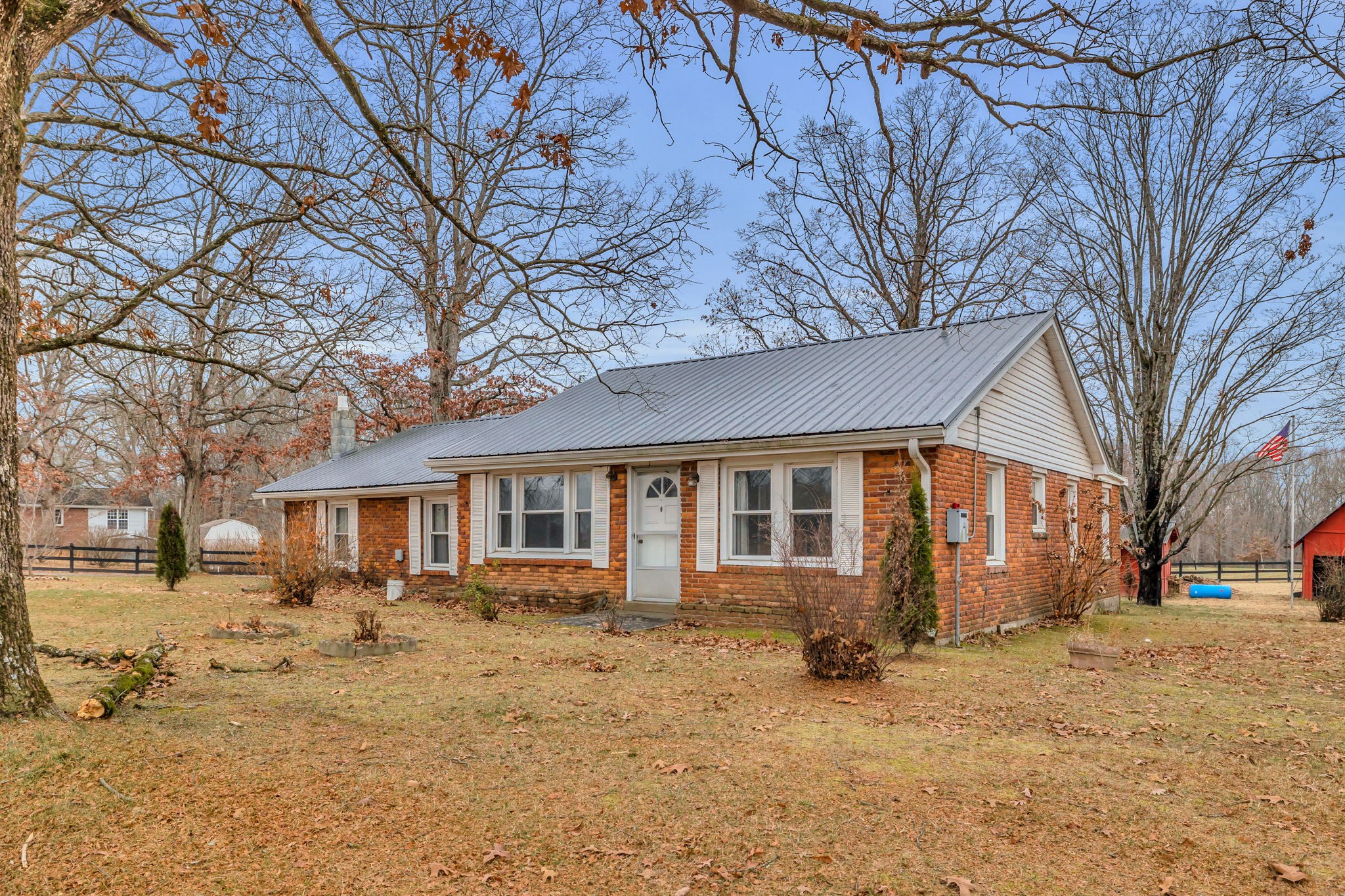 7203 Old Franklin Road Fairview, TN 37062 - Photo 4 of 43 a front view of a house with a yard