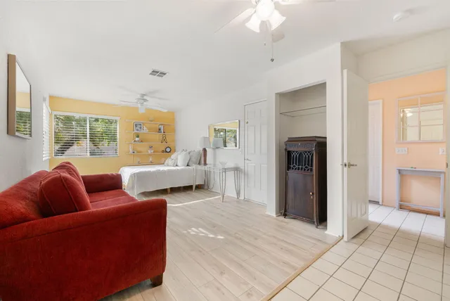 a living room with furniture and a window