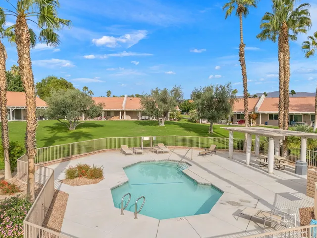 an aerial view of a house with outdoor space patio and swimming pool