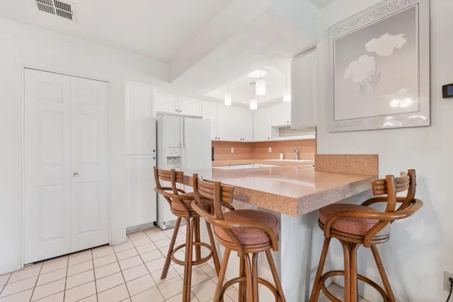 a view of a dining room and chairs