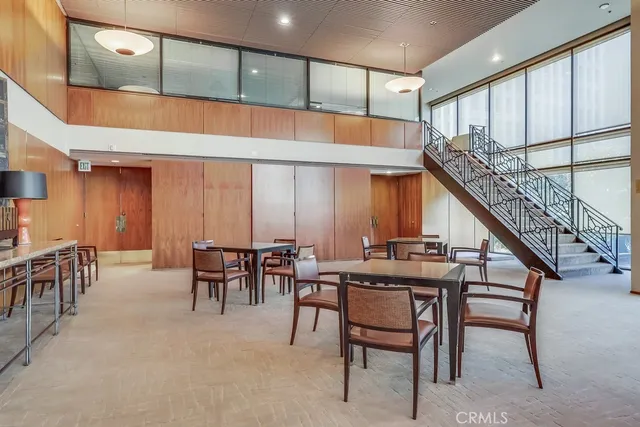a view of a livingroom with furniture and a window