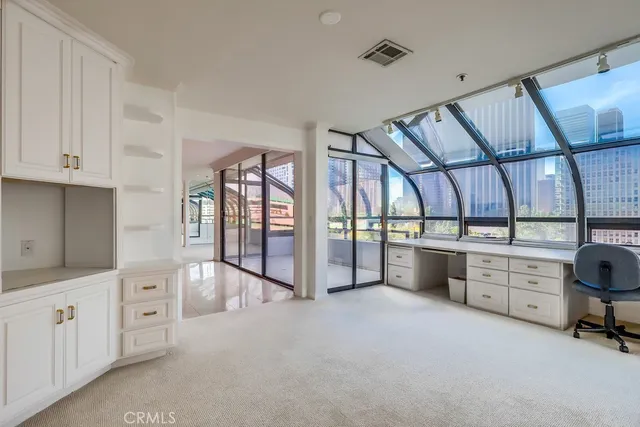 a large white room with window