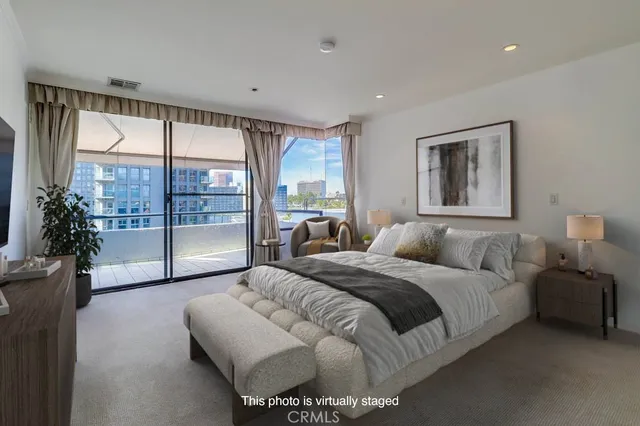 a bedroom with a large bed and a large window