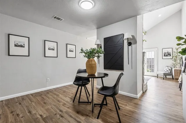 a view of a livingroom with furniture and wooden floor