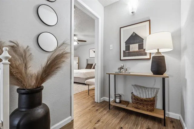 a living room with furniture and a mirror