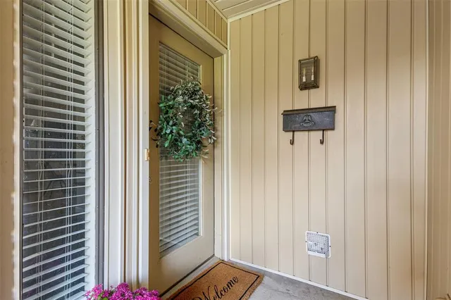 a view of a door and a window